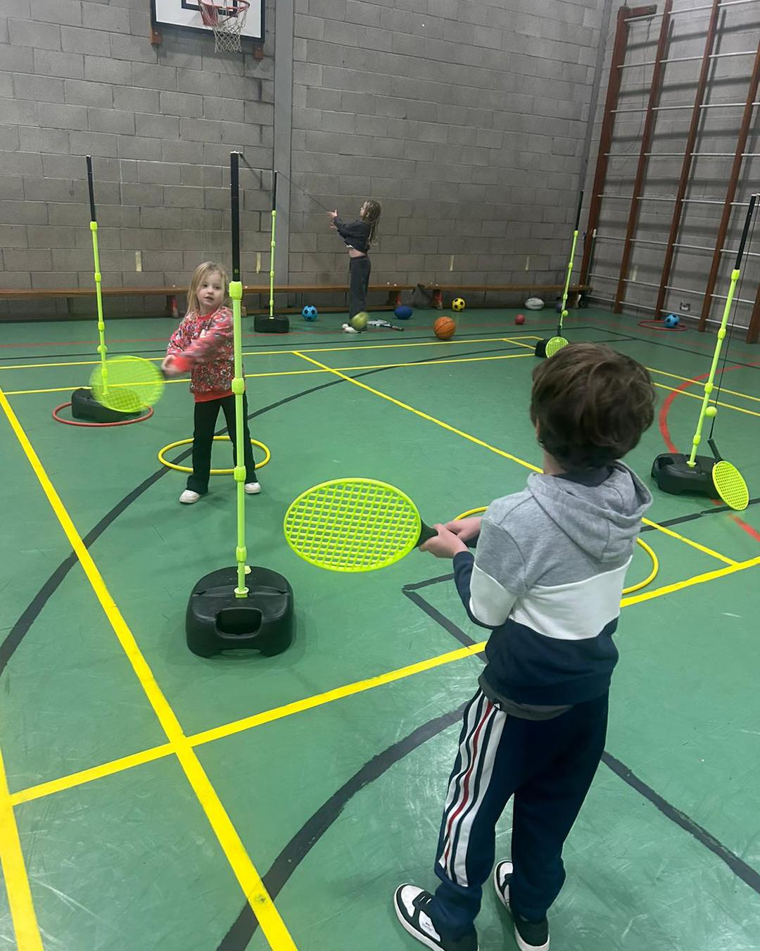 Children enjoying outdoor sports at camp